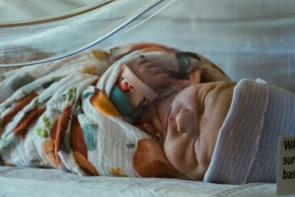 Photo by Olivia Anne Snyder a baby in a crib
